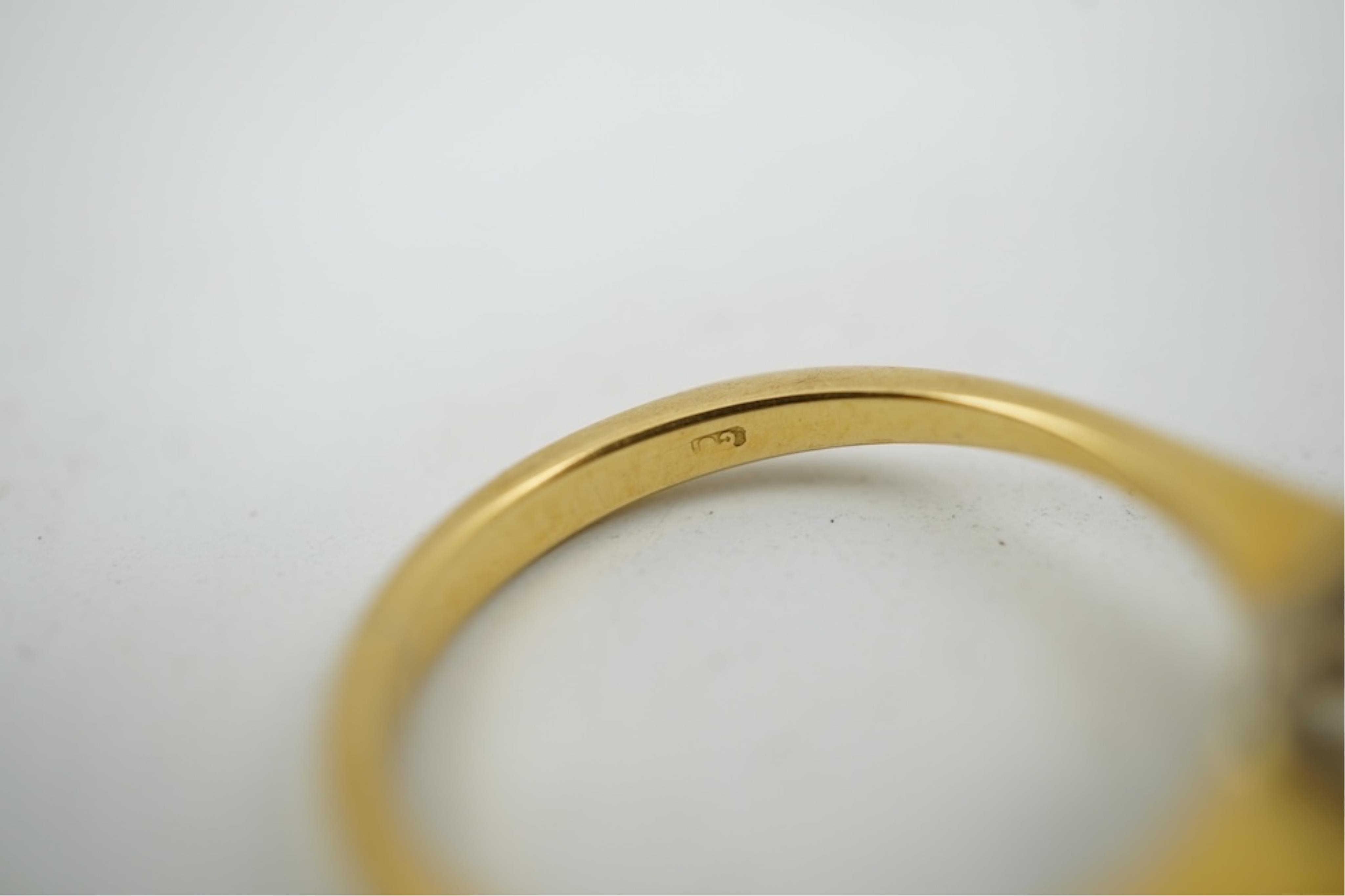 A modern 18ct gold and diamond set circular cluster ring, size M, gross weight 3.2 grams.